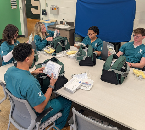 Students receiving skills bags provided by donors 